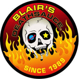 A circular graphic logo featuring a white skull with one blue eye and one yellow star, surrounded by red, orange, and yellow flames. The text reads 'BLAIR'S DEATHSAUCE' at the top and 'SINCE 1989' at the bottom on a white background.
