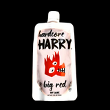 Squeeze pack of hardcore Harry big red hot sauce on a black background