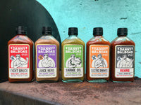 All 5 Danny Balboa's sauces on a concrete ledge
