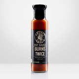 Bottle of Grumpy Gary's Burns Twice hot sauce on a white background