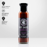A 245ml bottle of Grumpy Gary's Garlic Hot Sauce with awards on a white background.