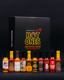 A collection of Hot Ones Season 29 hot sauce bottles in front of a Hot Ones branded box on a black background.