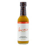 A 176g bottle of Quentin's White Hot Mustard Sauce on a white .background.
