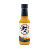 A 148ml bottle of Microsaucerie Piko Peppers Garlic Delight Hot Sauce on a white background.