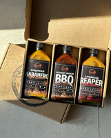 3 bottles of Pepper by Pinard sauces inside the gift box.