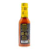 Rear view of a 148ml bottle of Hot ones sauce "The Last Dab: Xperience" on a white background.