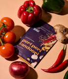 Sachet of Aunty Jenny Peri Peri Tandoori Blend amongst fresh vegetables. Available to buy online in Australia at Blonde Chilli.