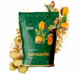 30g sachet of Aunty Jenny Turmeric Powder surrounded by turmeric root. Available online in Australia at Blonde Chilli.