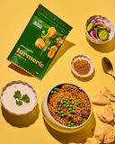 30g sachet of Aunty Jenny Turmeric Powder surrounded by bowls of food. Available online in Australia at Blonde Chilli.