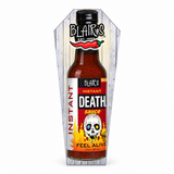 A 150ml bottle of Blair's Instant Death Sauce in coffin-shaped packaging box. Available to buy online in Australia at Blonde Chilli.