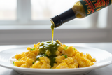 A bottle of Jibba's Smoked Jalapeno drizzled over a plate of scrambled eggs - buy online Australia | Blonde Chilli.