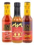 Three bottles of HOT ONES hot sauce lined up against a white background: The Classic Original, The Last Dab XXX, and Los Calientes Barbacoa. Buy online in Australia | Blonde Chilli