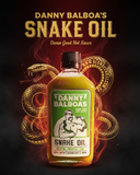 Danny Balboa's Snake Oil hot sauce bottle with a snake design on a dark background