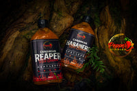 Pepper By Pinard hot sauces laying in a log.