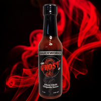 Sauceworks CHI-GHOST-LE Ghost Chilli Chipotle Sauce is a new product now available to buy at BLONDE CHILLI in Australia. Image shows bottle on a red smoke background.