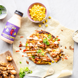 Culley's Sriracha Mayo bottle lies besiade a corn topped pizza in a photo shoot