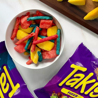 Takis Blue Heat and Takis Fuego chips in a bowl of watermelon and mangoes.