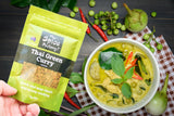 The Spice Factory Thai Green Curry packet hhovering beside a bowl of Thai Green Curry.